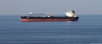 Naval vessels in the Strait of Hormuz with missiles and radar, highlighting Iran’s blockade of the vital oil route.