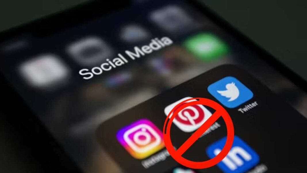 Smartphone screen showing social media apps with a red prohibition sign over them