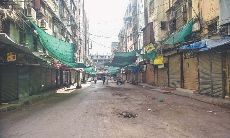 Empty Karachi market with shops closed early at 8:30 PM