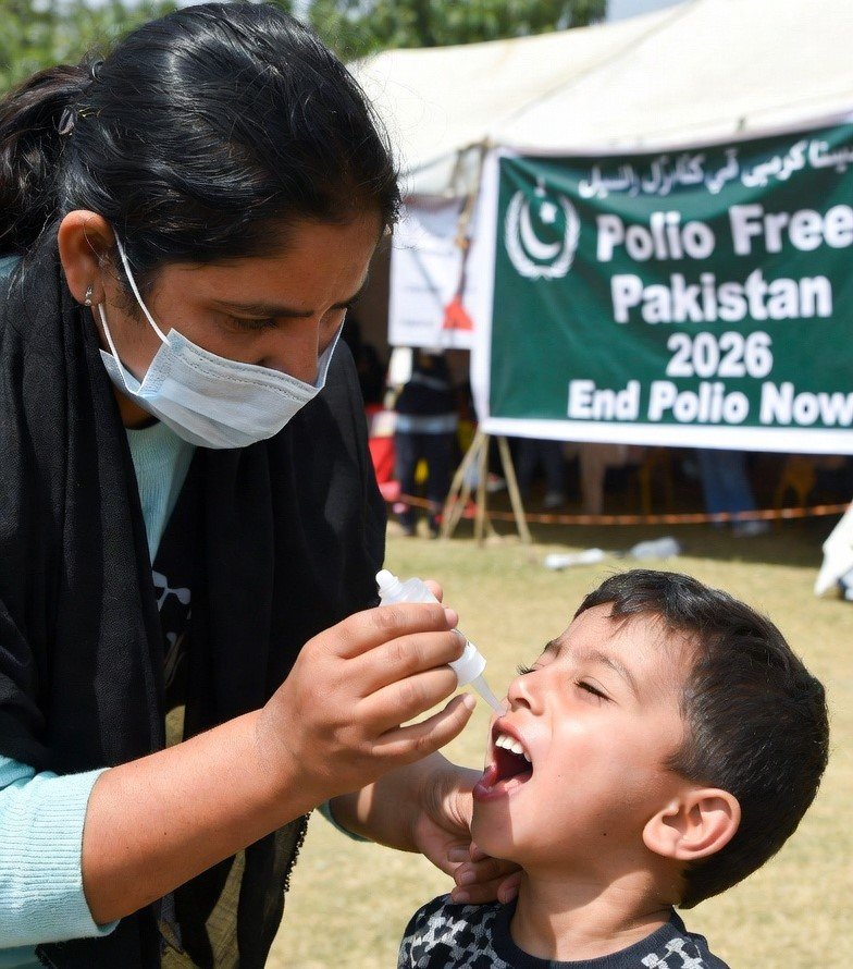 Pakistan Polio Campaign 2026 Shows Progress, 2nd Phase Starts April 13 Health worker administering polio drops to a child during Pakistan polio campaign 2026