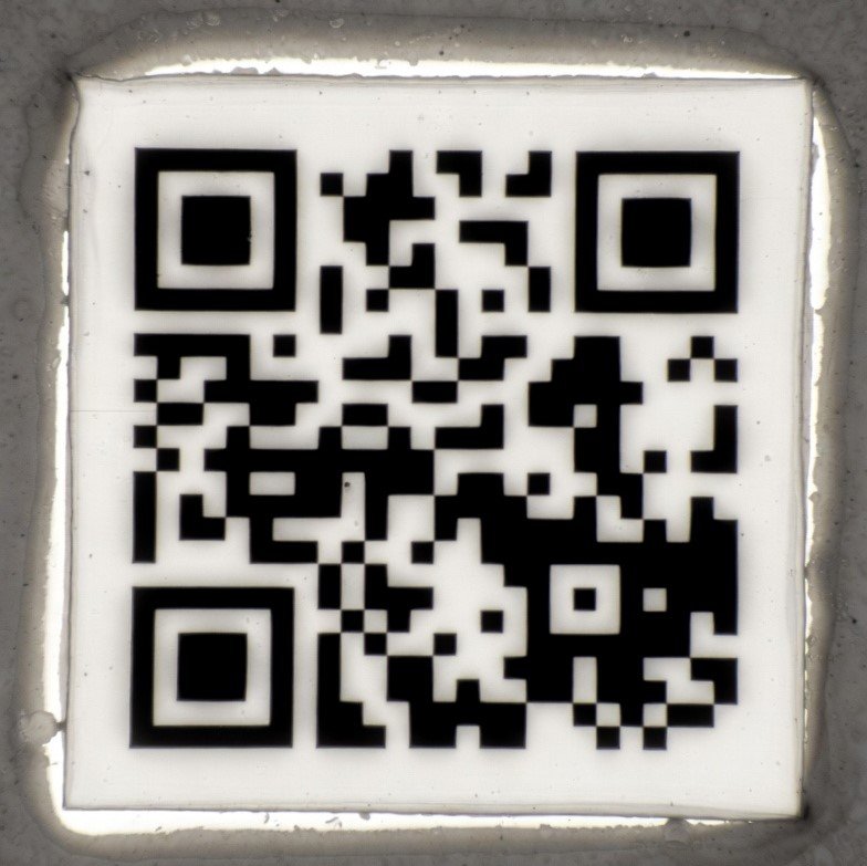 Smallest QR code engraved on ceramic, visible under an electron microscope