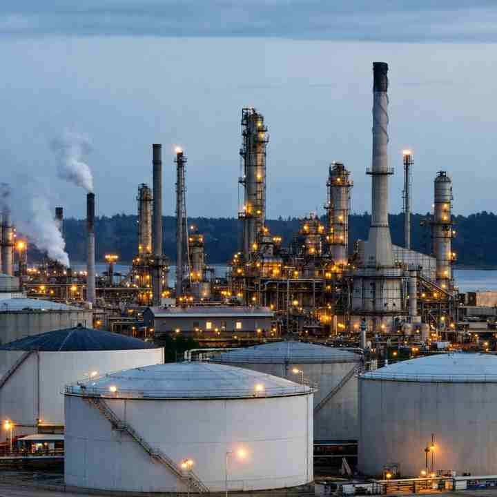 Oil refinery and storage tanks showing impact of global oil prices on kerosene price increase in Pakistan