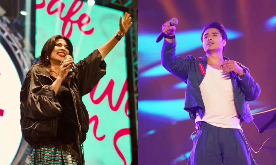 Ali Zafar and Meesha Shafi performing on stage holding microphones