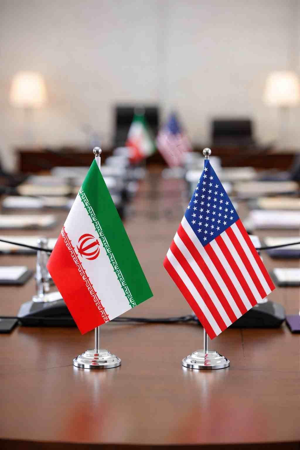 Iran US Talks End Without Deal iran and us flags on table during diplomatic talks