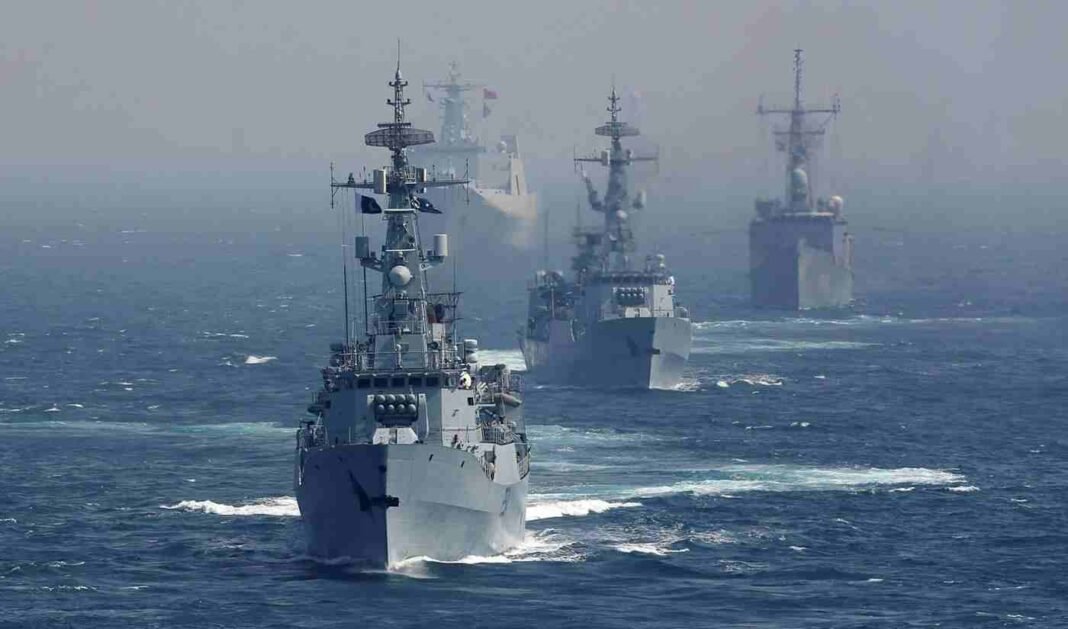 Military warships operating in the Strait of Hormuz during regional tensions