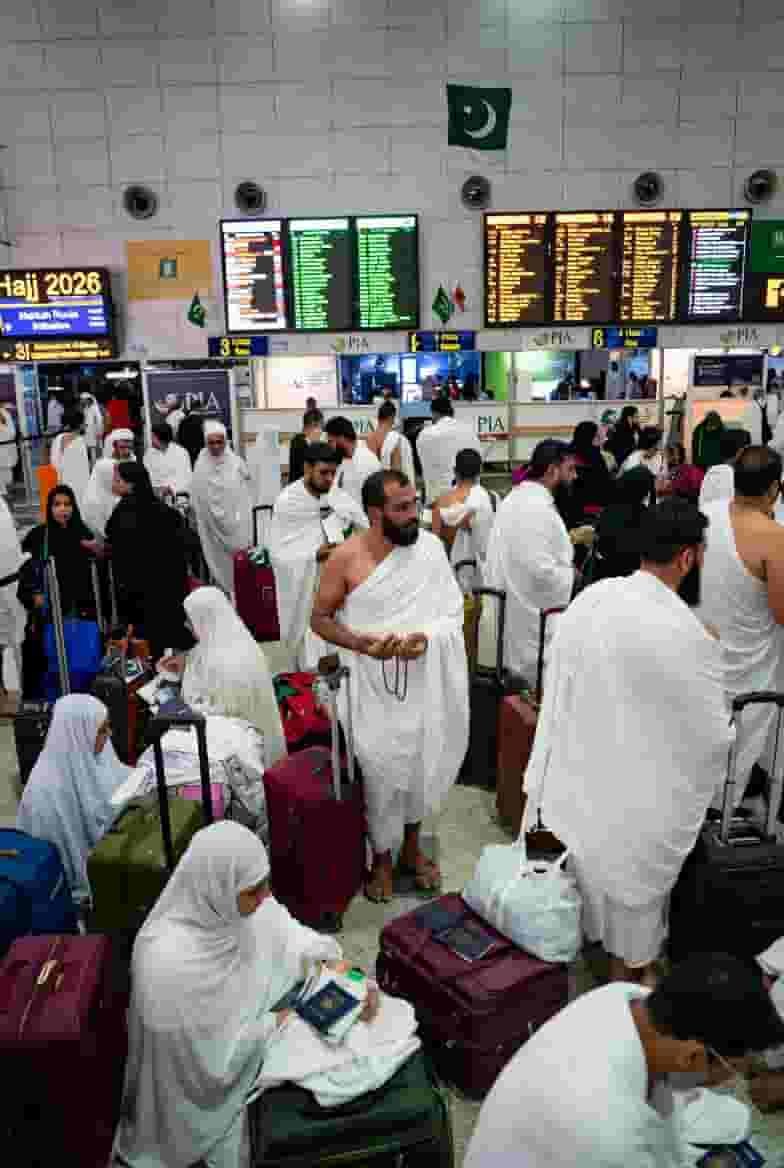 Pilgrims at Karachi airport preparing for Hajj 2026 departure during official Hajj operation start