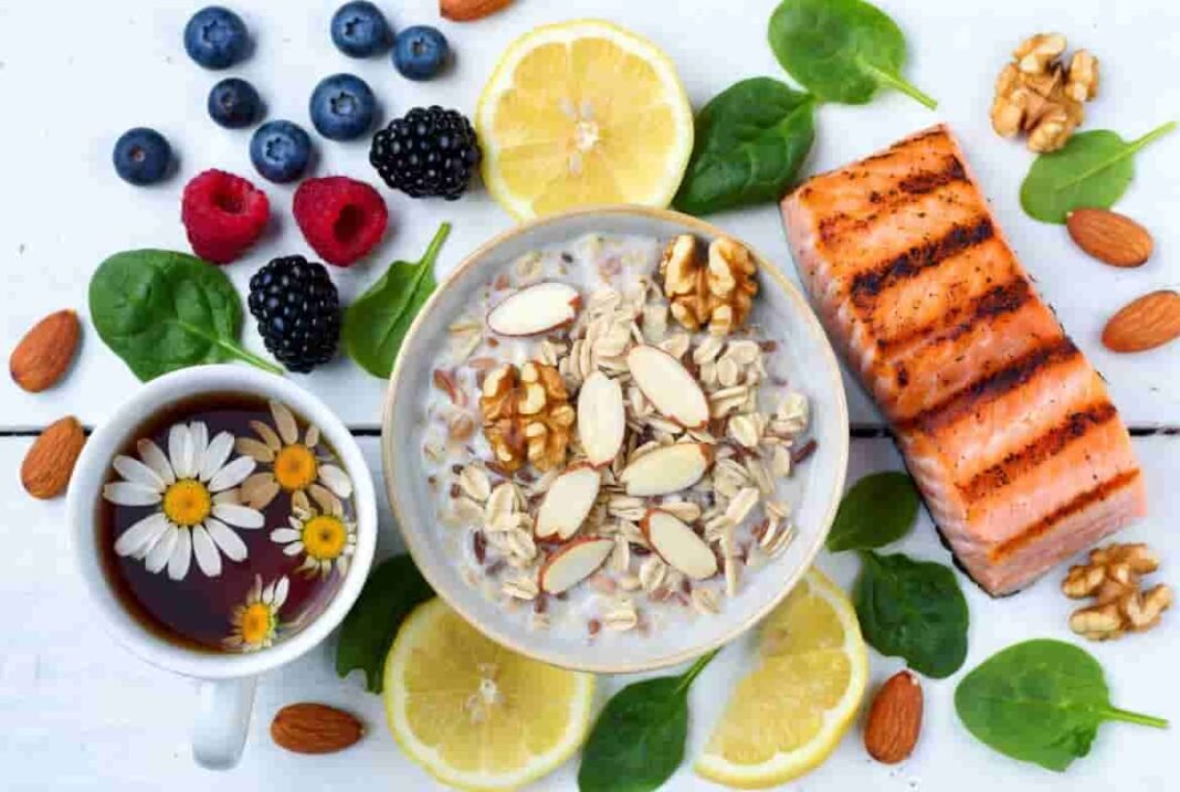 Healthy diabetes-friendly foods for stress and migraine relief including oats, nuts, salmon, spinach, and herbal tea
