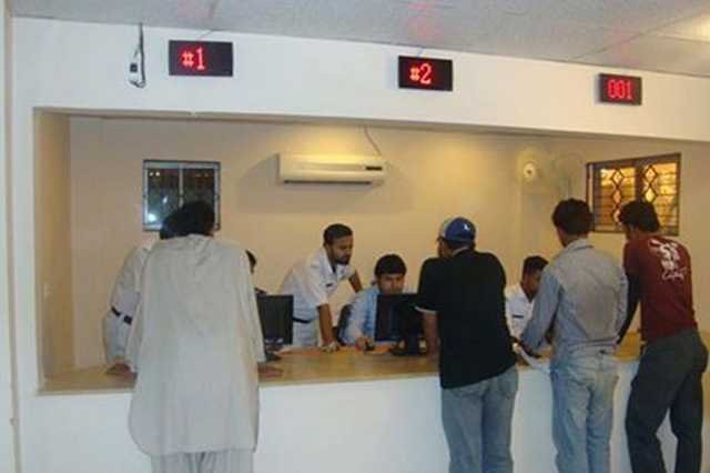 Citizens at driving license office counter in Pakistan for license processing