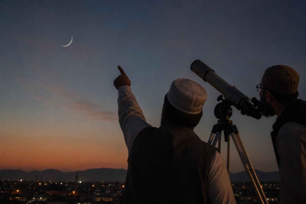 Pakistan Confirms Zil Hajj Moon, Eid al-Adha on May 27 Religious scholars sighting the Zil Hajj moon through a telescope in Pakistan at sunset