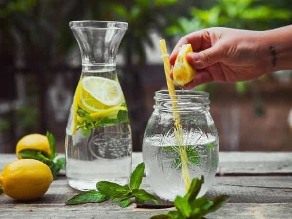 Fresh glass of lemon water showing health benefits
