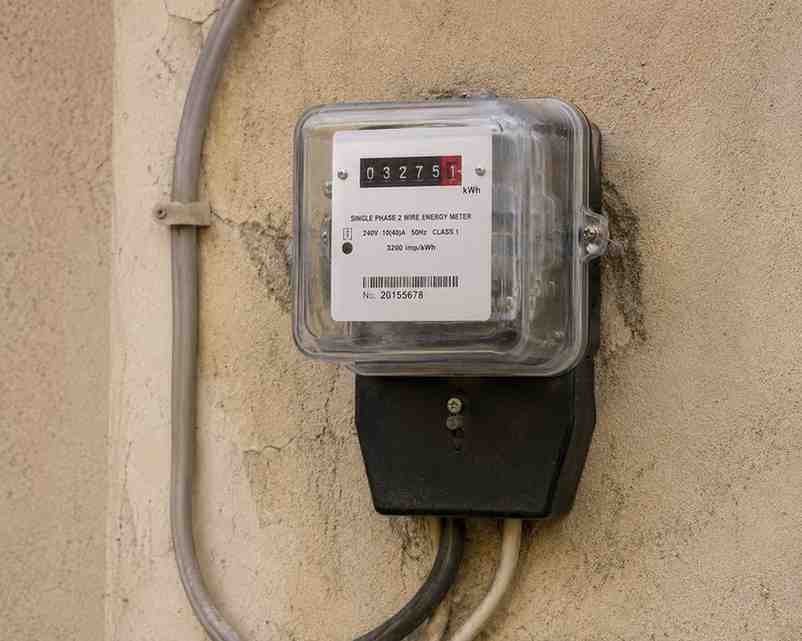 Electricity meter mounted on an exterior residential wall in Pakistan