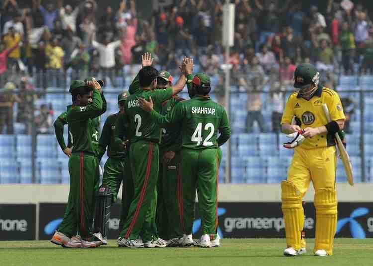 Bangladesh players celebrate after defeating Australia in an ODI match.