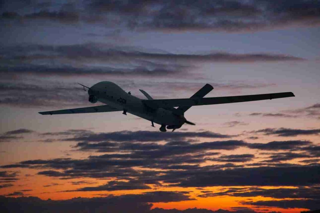 Military drone flying over the U.S. bases at sunset amid rising regional tensions