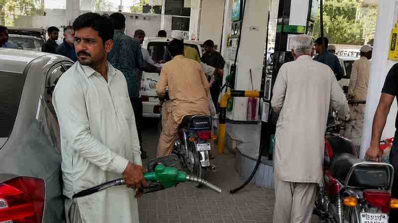 Public Pressure Wins Fuel Price Relief: Hafiz Naeem Customer refuels a vehicle at a busy petrol station in Pakistan following a major fuel price reduction.