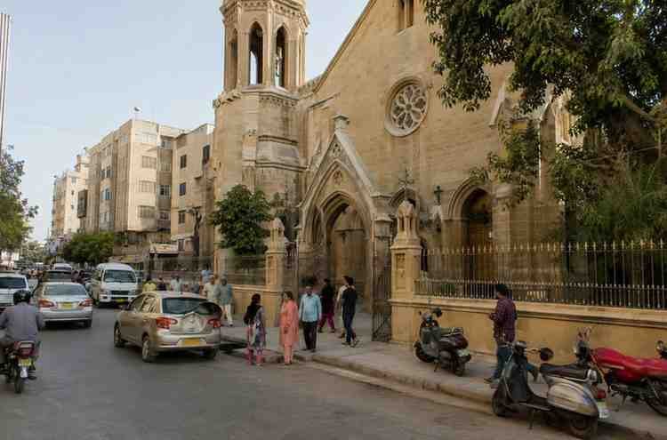 Historic church and busy street scene reflecting Karachi’s Goan heritage.