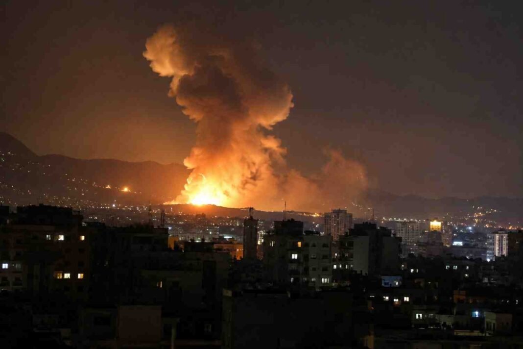 Night explosion over an Iranian city during reported US airstrikes.