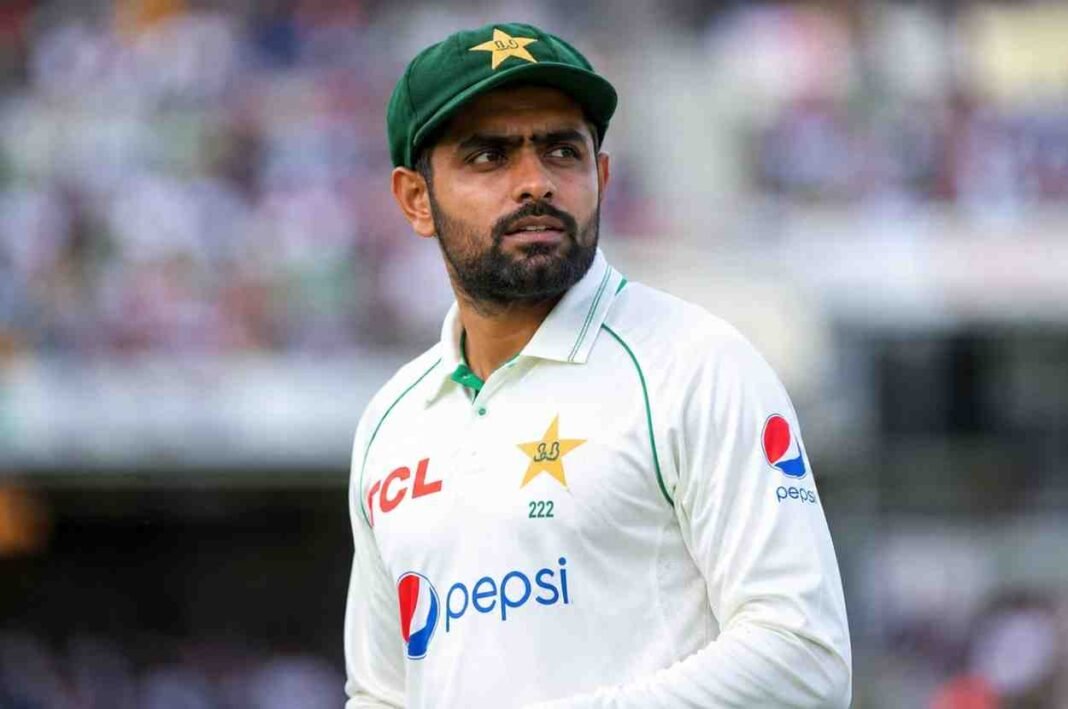Babar Azam during a Test cricket match in Pakistan's white cricket uniform.