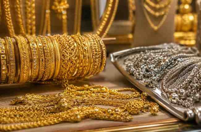 goldpricedro Gold and silver jewelry displayed in a jewelry shop in Pakistan.
