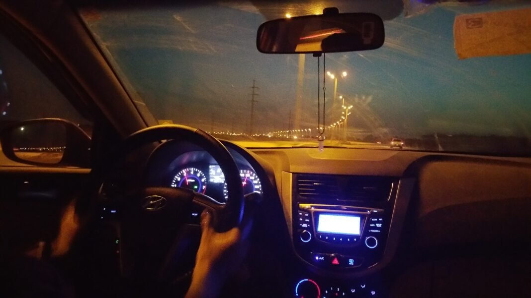 Best Car Insurance Companies 2026: Rates Compared best car insurance 2026: car driving on a highway at night
