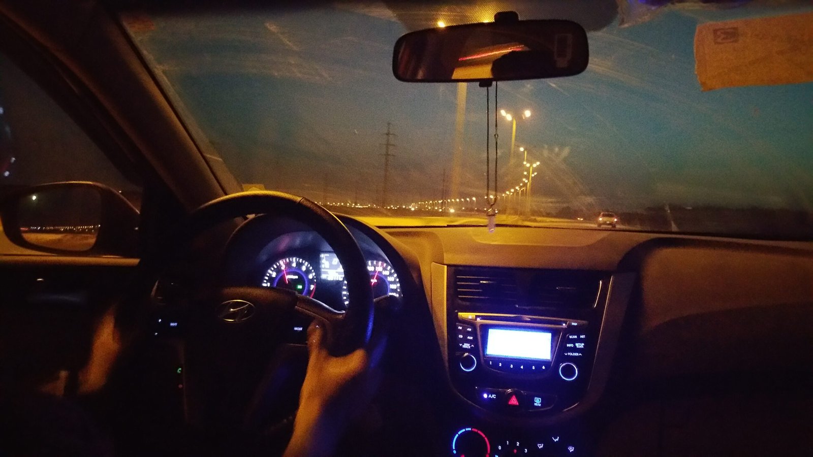 best car insurance 2026: car driving on a highway at night
