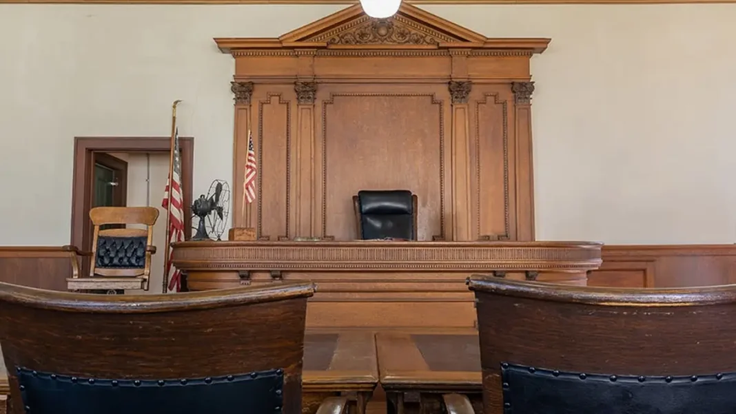 Best Pakistan Law Websites for Statutes & Cases Interior of a courtroom with wooden benches