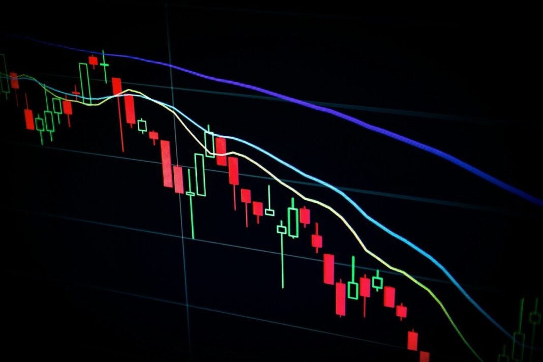 ETF vs Index Fund: What’s the Difference and Which Should a Beginner Choose? Stock market candlestick chart on a screen, the market behind the ETF vs index fund choice