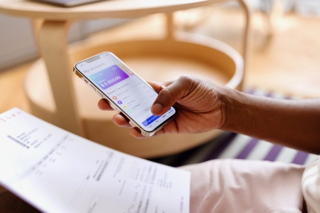How to Choose the Right Budgeting App in 2026 Person planning a budget on a smartphone