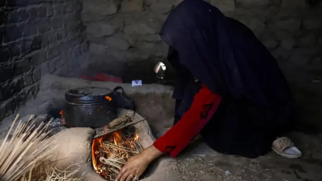 Afghanistan Hunger Hits Record High as 15.9 Million Face Food Crisis An Afghan woman cooking as Afghanistan acute hunger reaches record levels, IPC report