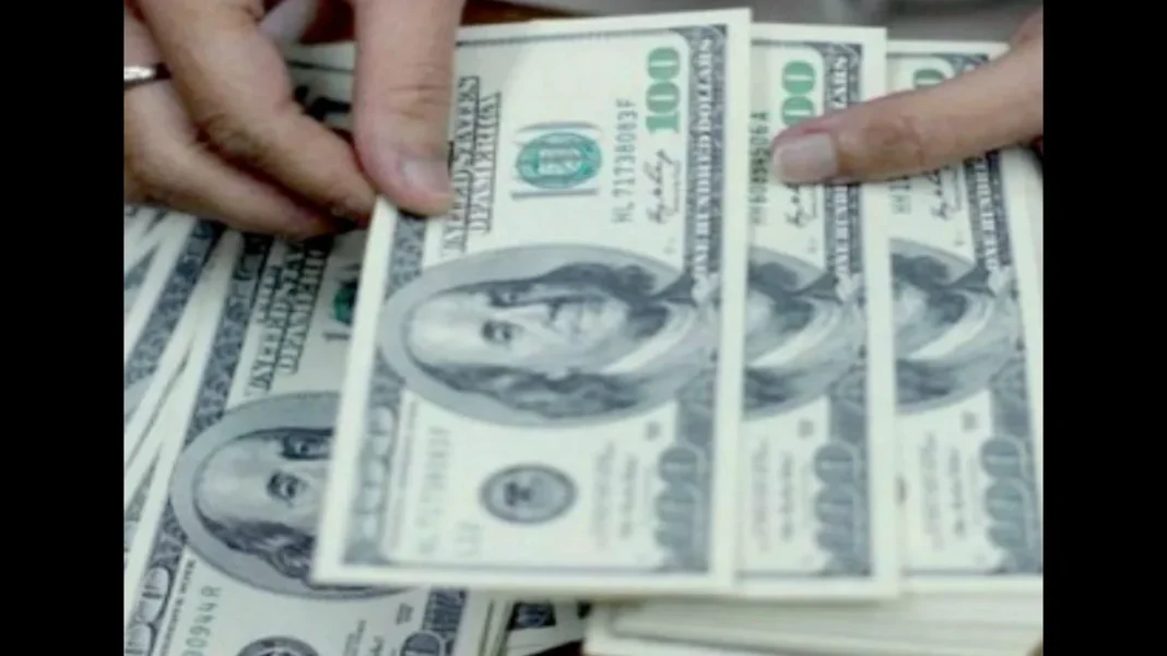 Pakistan Rejects $490m Loan Over High Cost Hands counting US dollar banknotes, as Pakistan rejects a $490m loan over its high cost