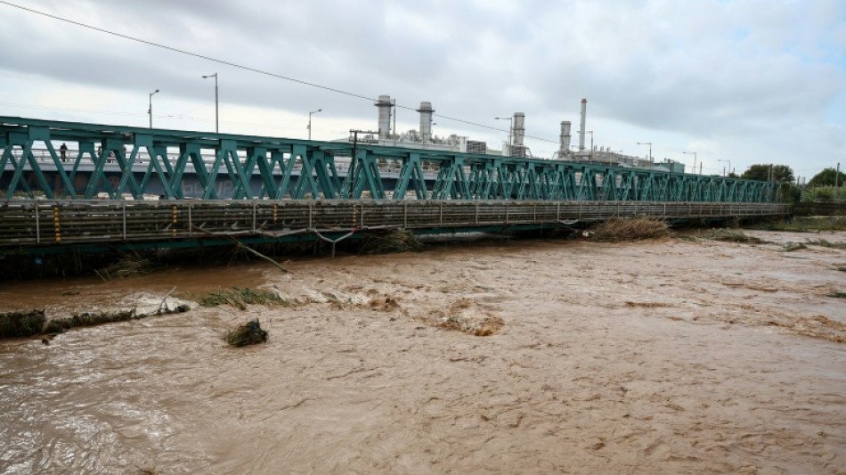 Two Dead as ‘Mini-Hurricane’ Floods Swamp Spain’s Catalonia Catalonia floods: a swollen muddy river flowing under a bridge in Spain