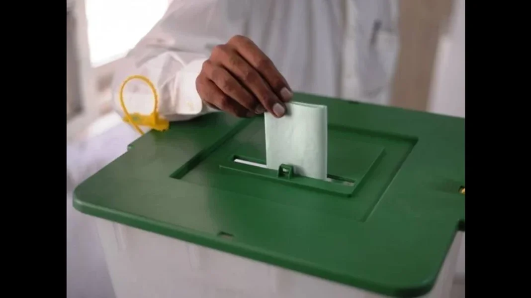 K-P Senate Elections 2027 Face Delay Threat Hand casting a ballot into a green ballot box — K-P Senate elections 2027
