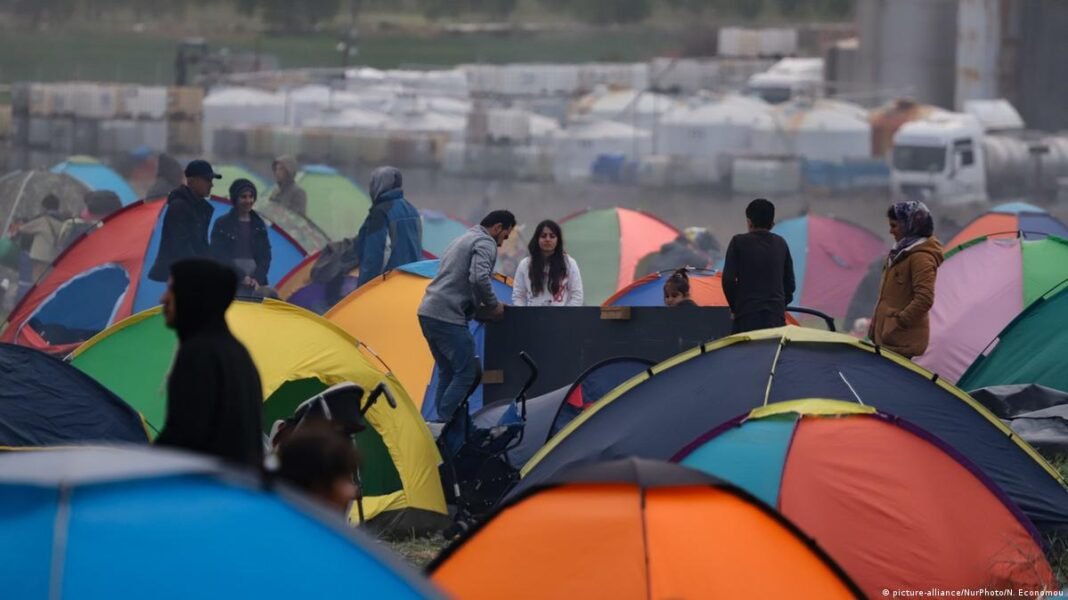 EU Plans Migrant Return Hubs Outside Bloc, Names Pakistan a Focus EU migrant return hubs: migrants at a camp in Diavata, Greece