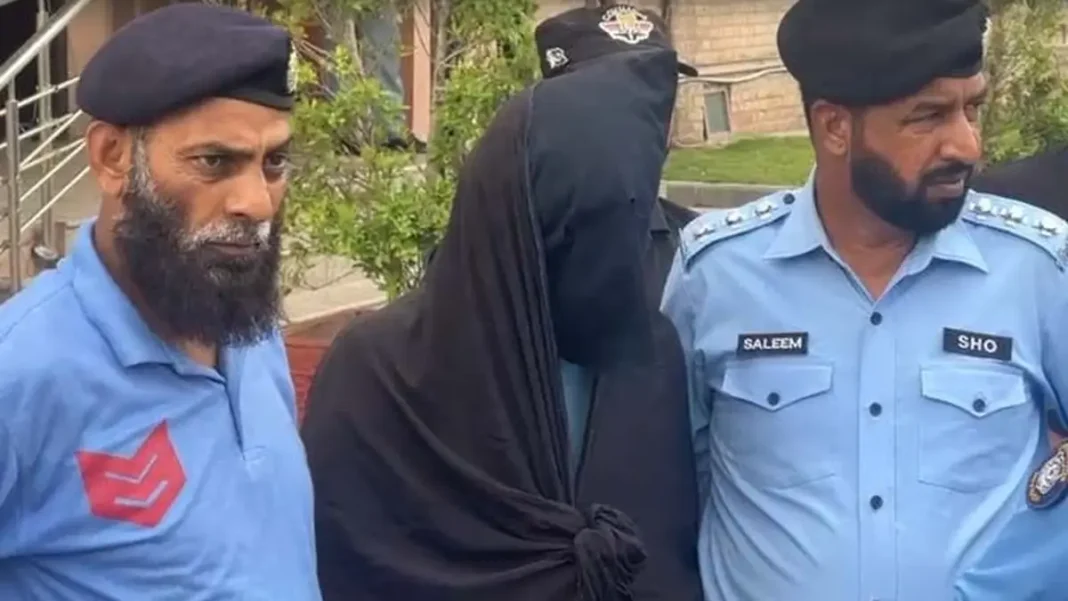ATC indicts accused in PAF officer case, summons witnesses for Nov 2 Police escort the hooded accused in the PAF officer case in Islamabad