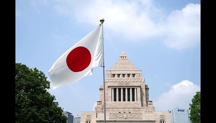 Japan raises permanent-residency fee to ¥200,000 and tightens income, language and pension rules Japan permanent residency: the Japanese flag flies outside the National Diet building in Tokyo
