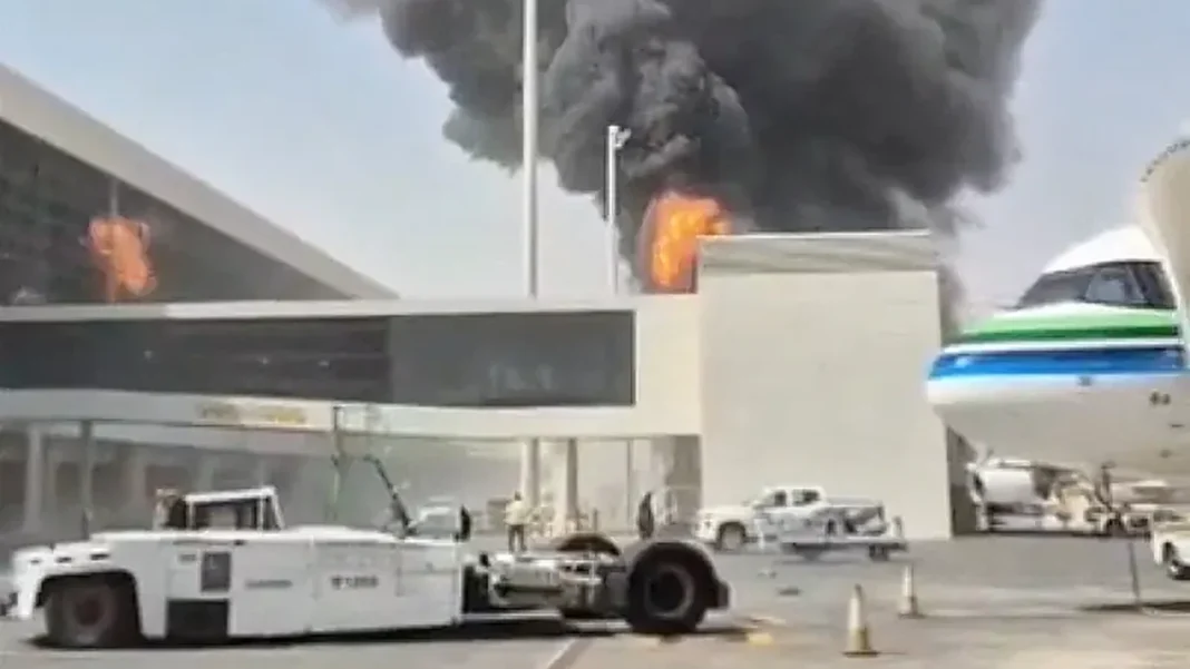 Pakistani National Killed as Fresh Houthi Strike Hits Riyadh Airport, 11 Wounded Pakistani killed Riyadh airport strike: fire and thick smoke at a King Khalid International Airport terminal with an aircraft on the tarmac