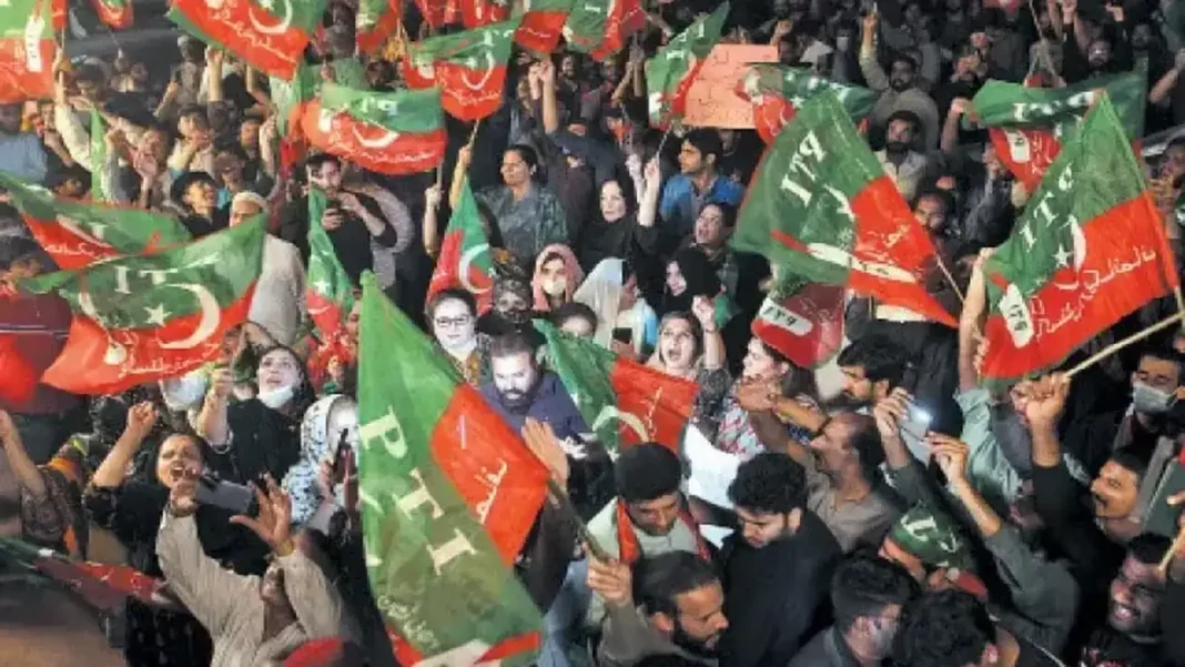 PTI KP Protest on Hold to Protect Workers PTI supporters waving party flags at a rally, PTI KP protest