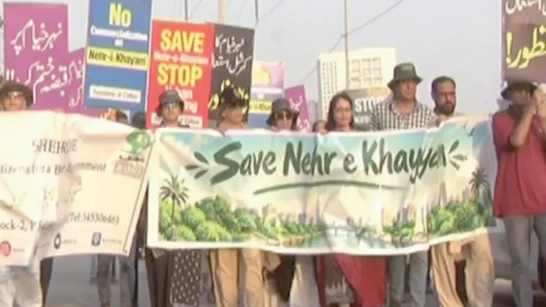 Karachi Residents to Take Nehr-e-Khayyam Case to High Court Residents hold a Save Nehr-e-Khayyam banner at a protest - Nehr-e-Khayyam court petition