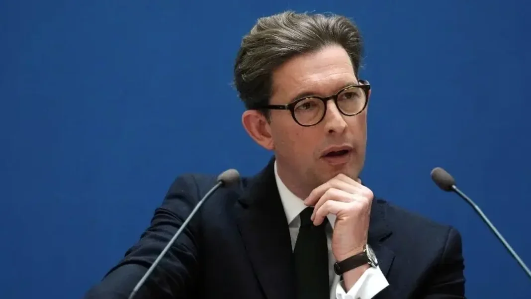 UK Spy Chief Accuses Iran and Russia of Hybrid Campaigns Against Britain MI5 Director General Ken McCallum speaking; he accused Iran and Russia of hybrid campaigns against Britain