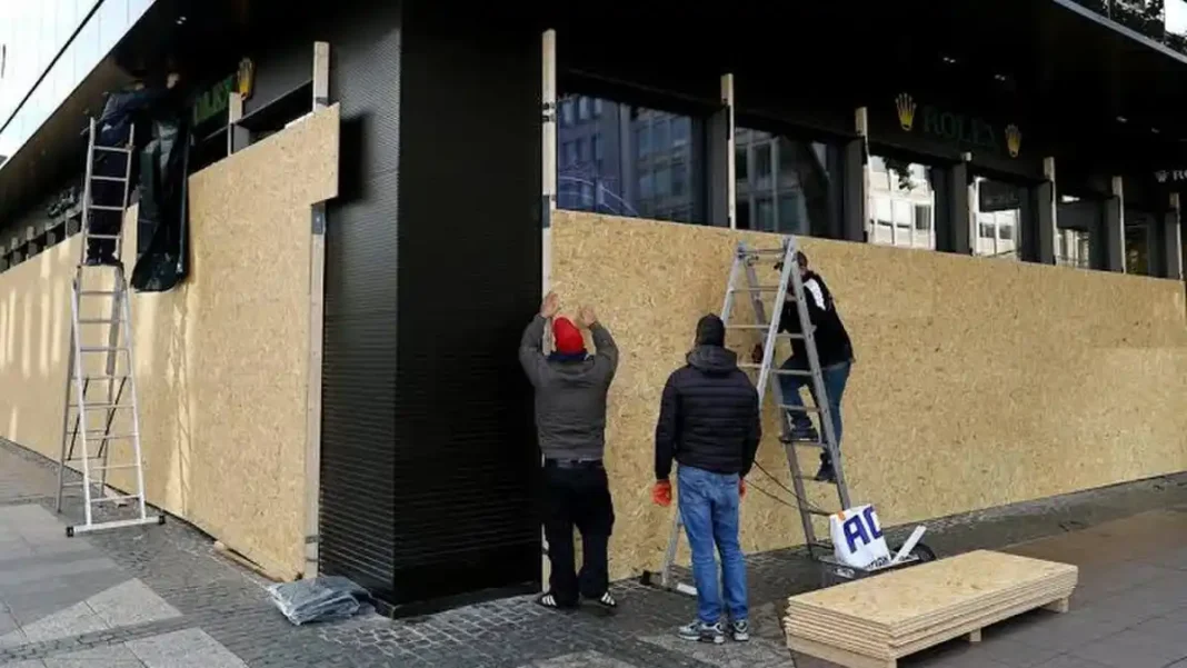 Gen Z Protests Germany Draw 160,000 to Rallies Workers board up a shop in Berlin ahead of Gen Z protests Germany rallies
