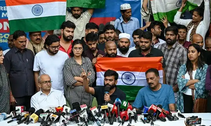India shuts New Delhi’s Central Park for two days ahead of ‘cockroach’ rally over voter rolls Cockroach Janta Party rally: Abhijeet Dipke with supporters behind a bank of microphones beside Indian flags at a New Delhi press event