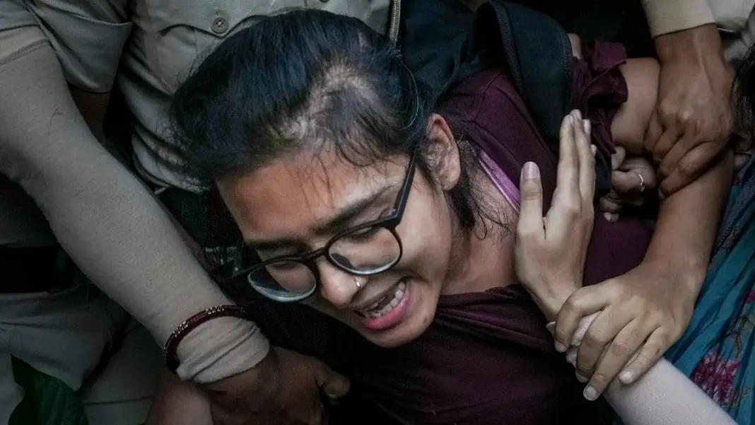 AISA Chief Neha Bora Released After Delhi Detention; CJP’s Dipke to Face Magistrate AISA president Neha Bora being detained by Delhi Police during the Neha Bora Delhi detention