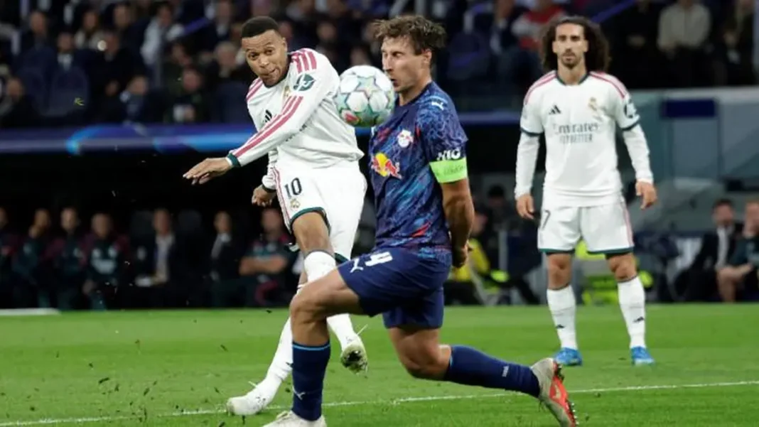 Real Madrid Thrash RB Leipzig 4-1 for Third Straight UCL Win Real Madrid's Kylian Mbappé against RB Leipzig. Real Madrid 4-1 RB Leipzig Champions League win.