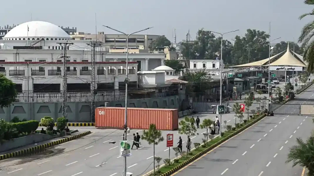 Talal Chaudhry Confirms Sohail Afridi Held in Preventive Custody Sohail Afridi preventive custody: a container blocks the road outside the KP Assembly in Peshawar after the emergency
