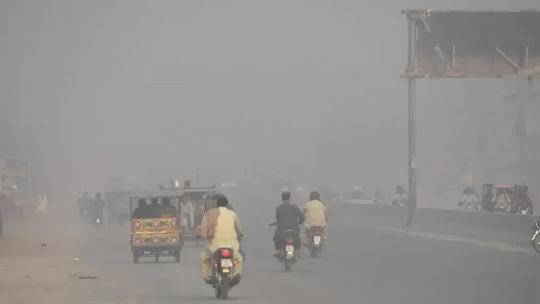 Lahore Tops World Pollution List as Smog Hits AQI 296 Smog over a Lahore road — Lahore smog AQI 296