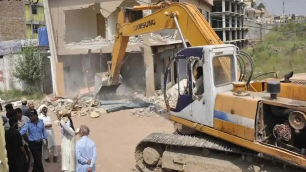 CDA Clears I-15 Land After 20-Year Wait An excavator demolishes a structure during an anti-encroachment operation — CDA I-15 encroachments