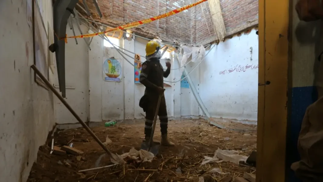 Peshawar School Tragedy Compensation: KP Governor Announces Rs1m for Each Bereaved Family Peshawar school tragedy compensation — a rescue worker clears debris at the collapsed Dir Colony school in Peshawar