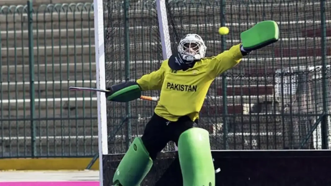 Pakistan hockey goalkeeping camp opens in Islamabad for 15 junior and senior goalies Pakistan hockey goalkeeping camp — a Pakistan goalkeeper in yellow kit making a save during training