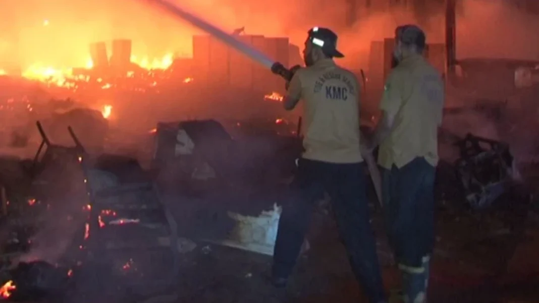 Karachi Furniture Market Fire Destroys 35 Shops Firefighters spray water on the blazing furniture market in Karachi, Karachi furniture market fire