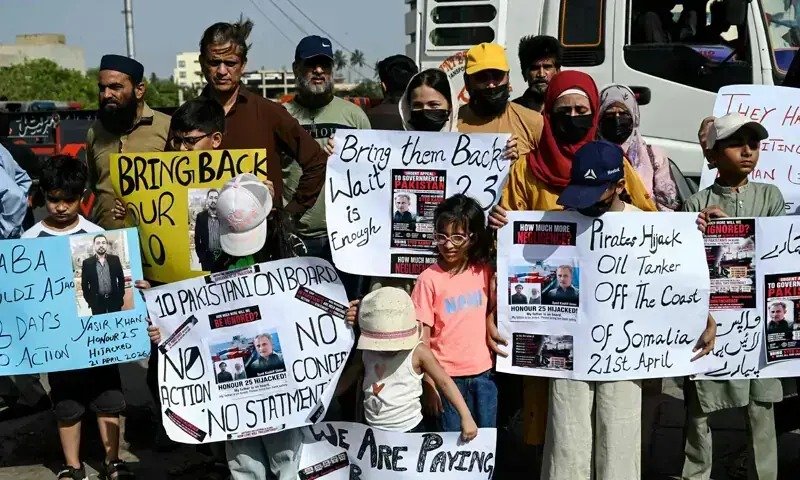 Four MT Honour 25 crew arrive in Karachi tomorrow, Dar announces Protest by families as the MT Honour 25 crew arrive Karachi on October 3
