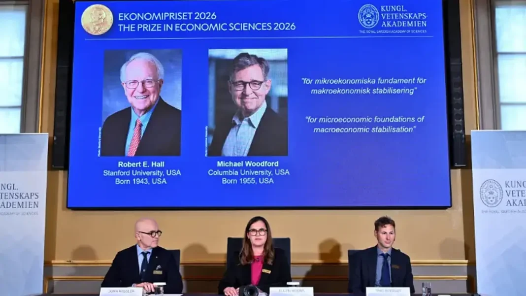 Nobel Economics Prize 2026 Goes to Hall and Woodford for Stabilisation Models Nobel economics prize 2026: portraits of Robert Hall and Michael Woodford on the announcement screen in Stockholm